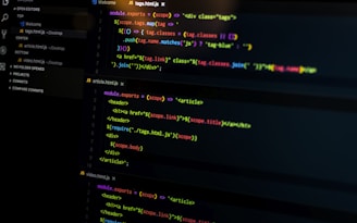 A computer screen displays various sections of code written in JavaScript. The code includes module exports and HTML tags within a text editor interface, which is divided into several panels. The text editor panel exhibits a dark theme with syntax highlighting, showing functions and variables.