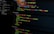 A computer screen displays various sections of code written in JavaScript. The code includes module exports and HTML tags within a text editor interface, which is divided into several panels. The text editor panel exhibits a dark theme with syntax highlighting, showing functions and variables.