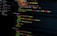 A computer screen displays various sections of code written in JavaScript. The code includes module exports and HTML tags within a text editor interface, which is divided into several panels. The text editor panel exhibits a dark theme with syntax highlighting, showing functions and variables.
