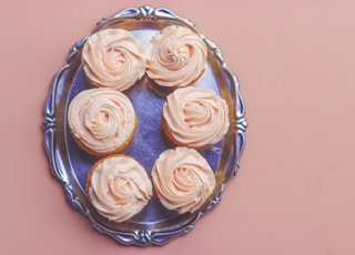 six cupcakes on stainless steel serving tray