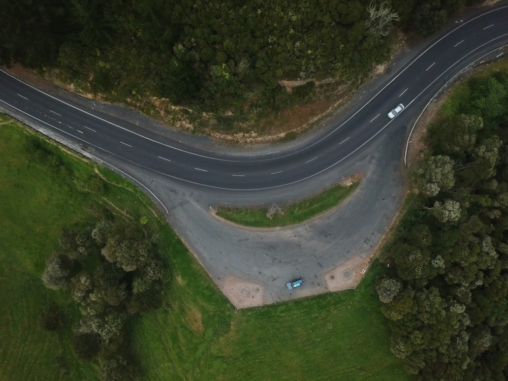 aerial photography of silver vehicle traveling at daytime