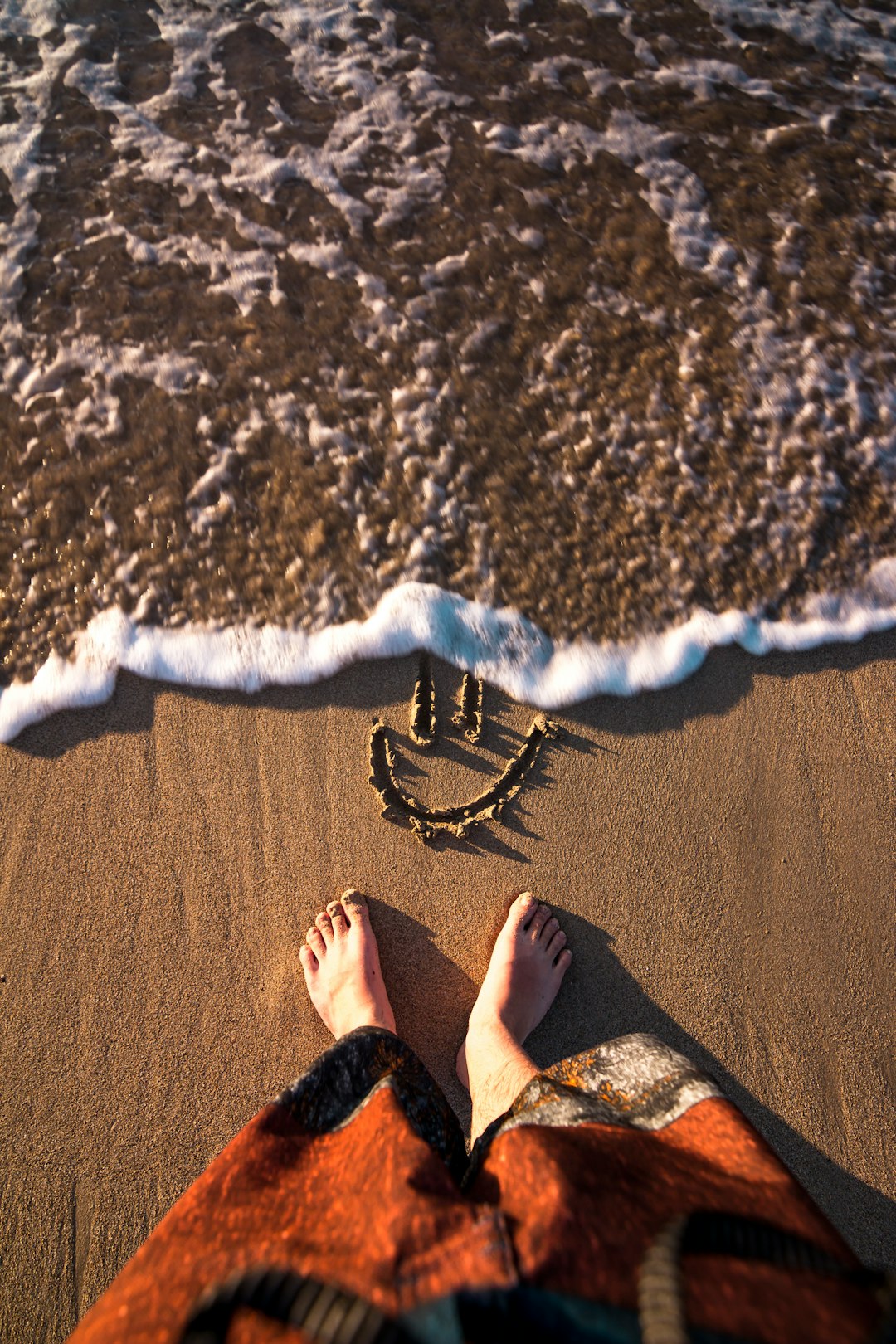 smiley doodle on sand