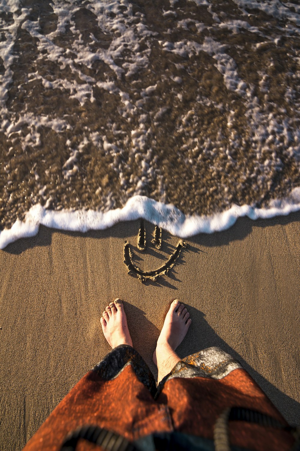 smiley doodle on sand