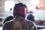 man wearing red head protector and gloves