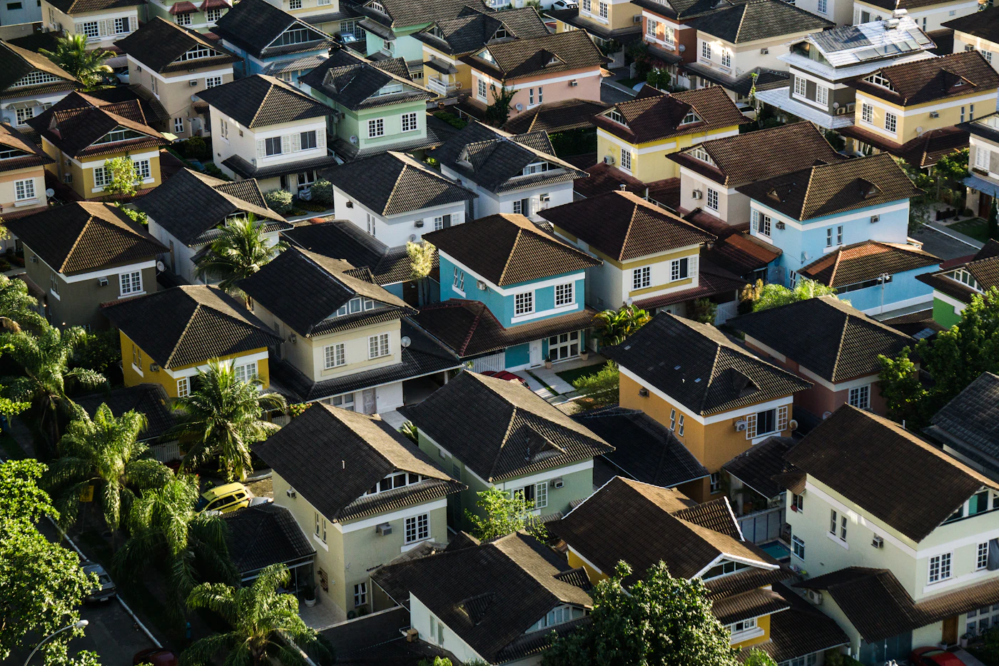 Aerial view over a residential neighbourhood of shingle roofs