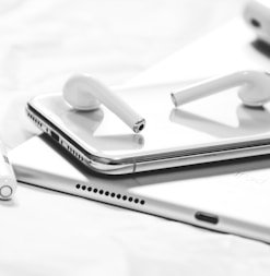 grayscale photography of iPhone X, AirPods, Apple Pencil and iPad