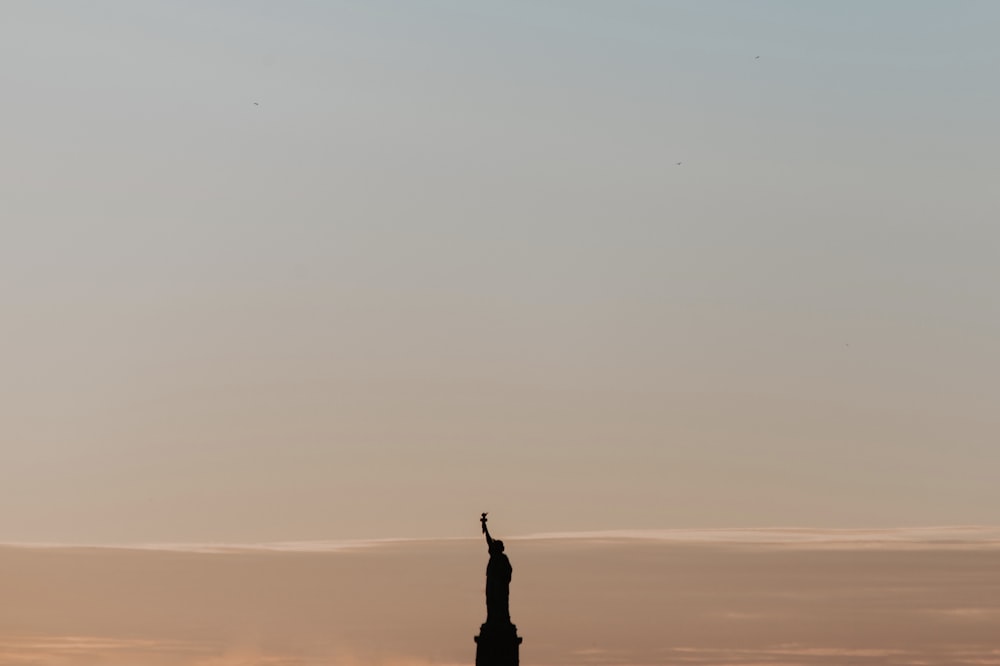 Statue of Liberty silhouette during daytime