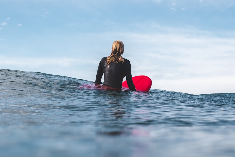 woman on board at beach during daytime