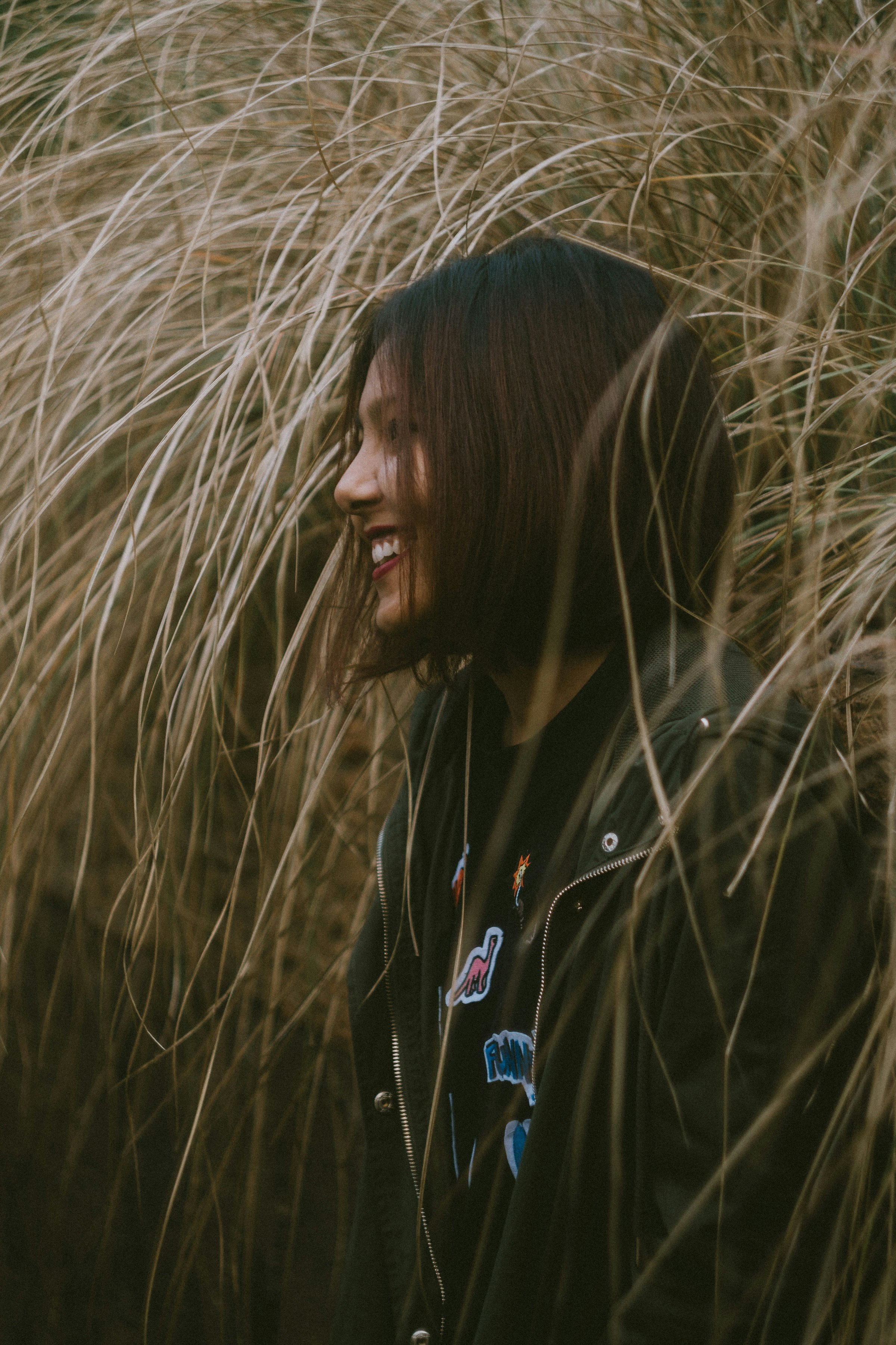 woman in black jacket smiling