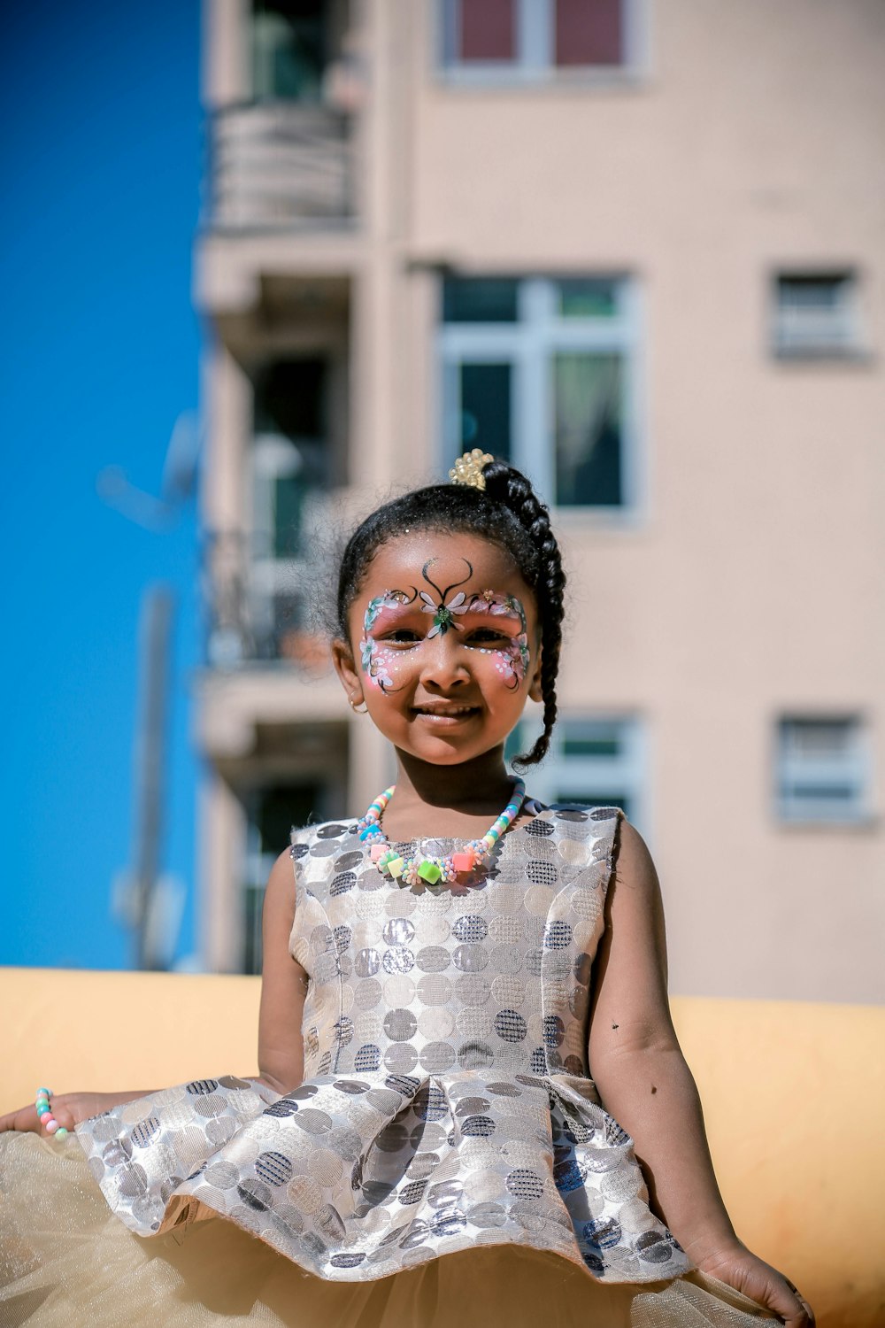 girl with face paint while smiling