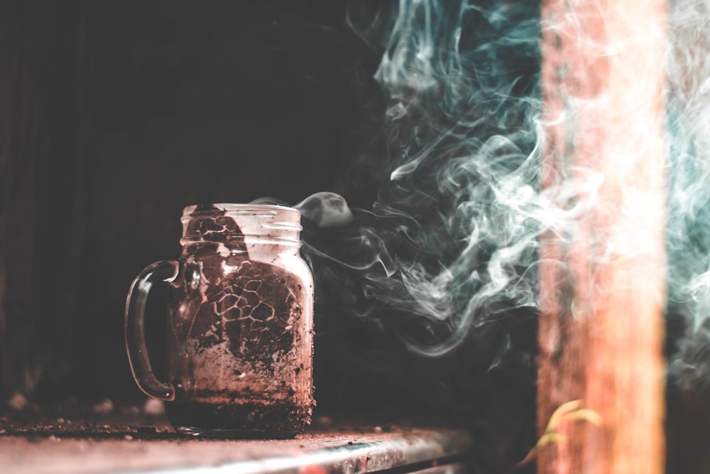 clear glass jar filled with brown liquid