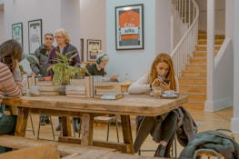 A vibrant cafe scene where someone reads betting tips on a tablet.