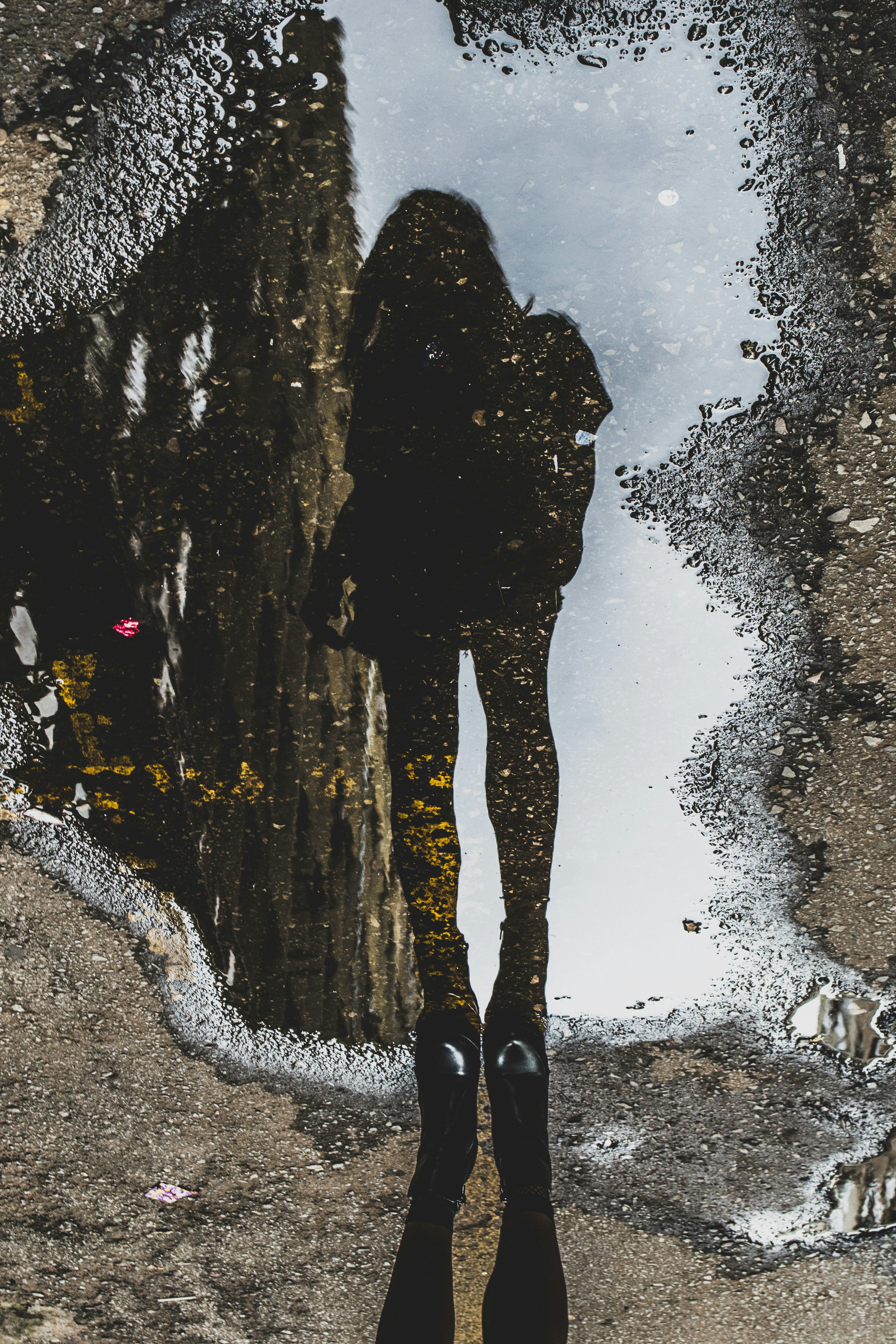 woman reflect on water during daytime