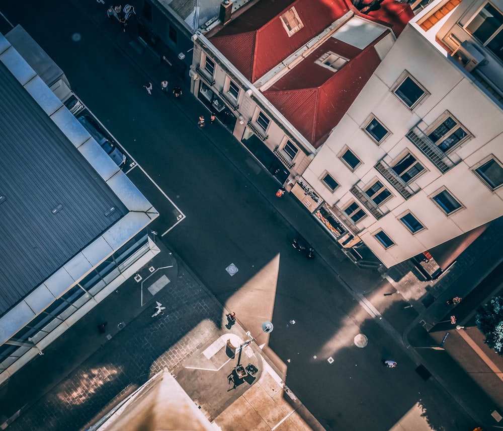 aerial photography of asphalt road between buildings