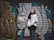 woman standing beside graffiti wall taken at daytime
