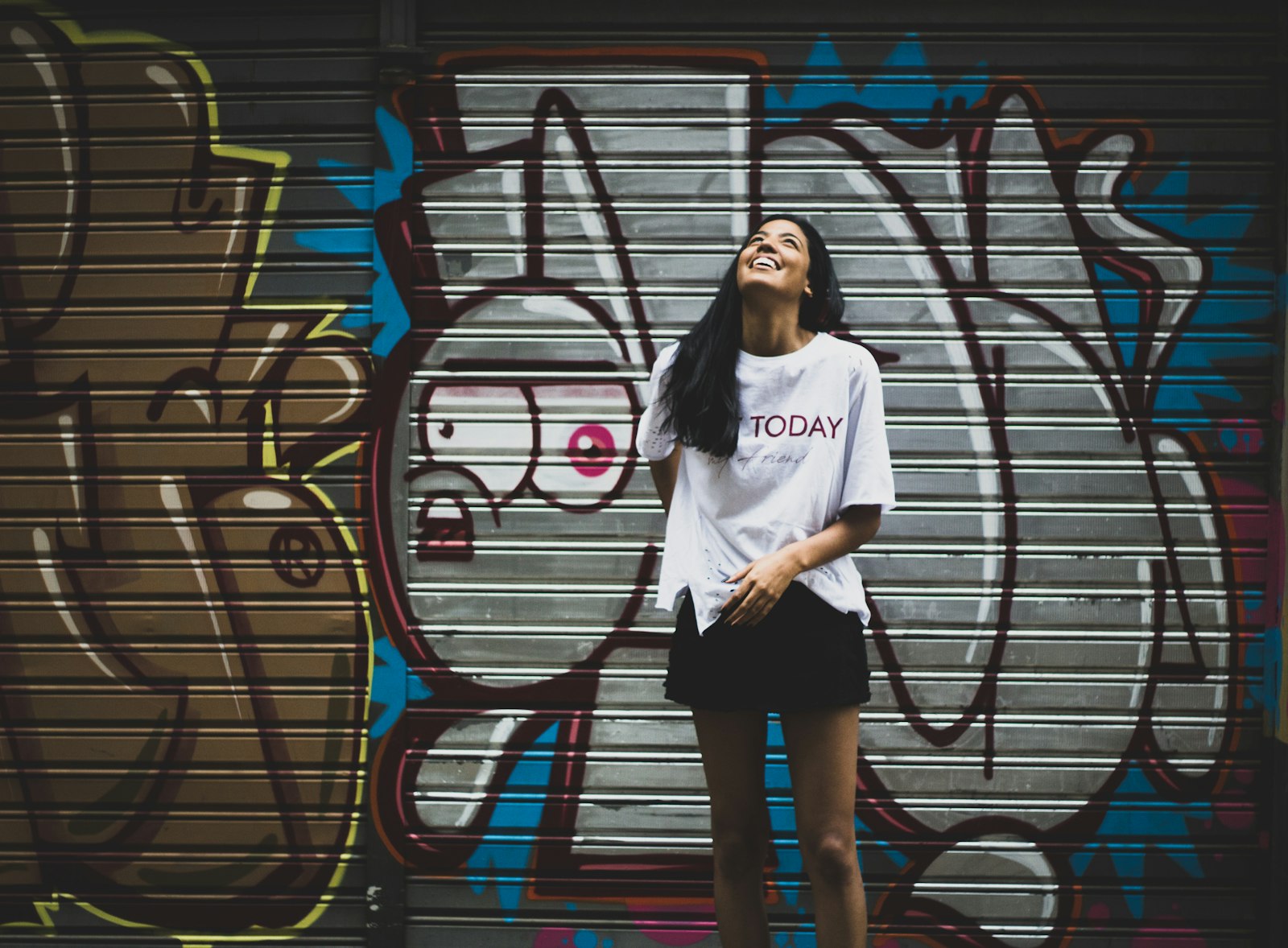 Canon EF 50mm F1.8 STM sample photo. Woman standing beside graffiti photography