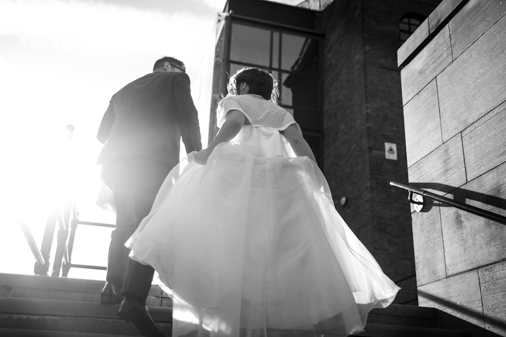 bride and groom walking on staircase