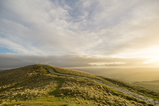 mountain under cloudy sky at daytime in Mam Tor United Kingdom