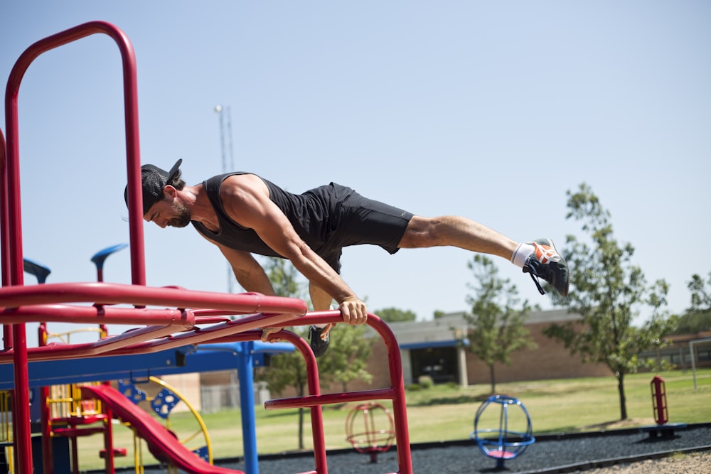 man doing planking on bar