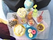 A colorful assortment of snacks and beverages on a table.