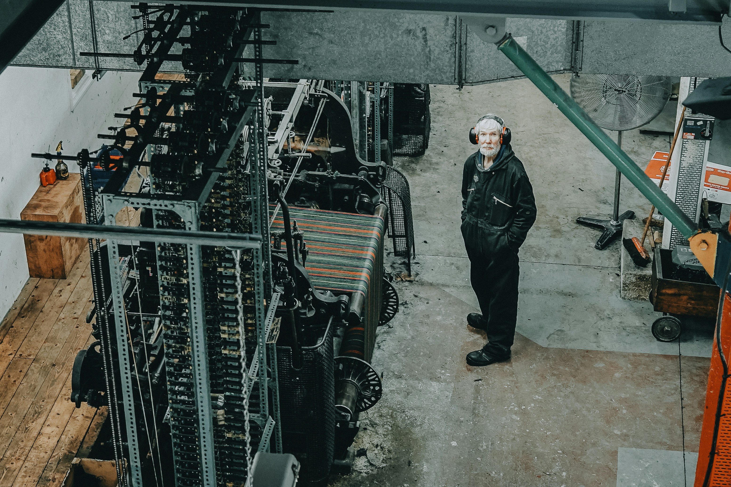 Man standing on front of industrial machine photo – Free City Image on ...