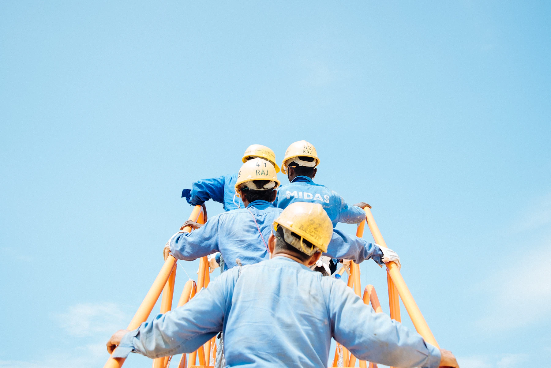 Crew members in safety helmets — stock reference