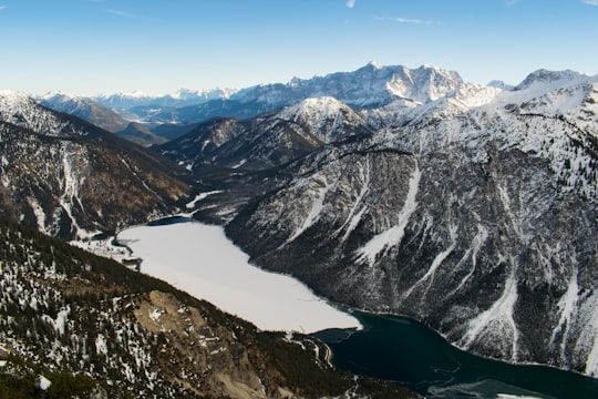 aerial photography of snow-capped mountain in Plansee Austria