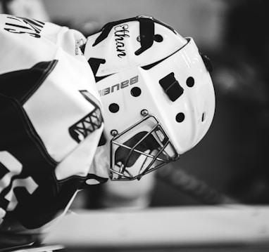 grayscale photo of ice hockey player