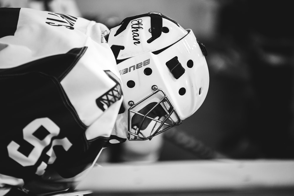 grayscale photo of ice hockey player