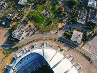 An aerial view of the upper deck seating area in a bustling stadium during a game.