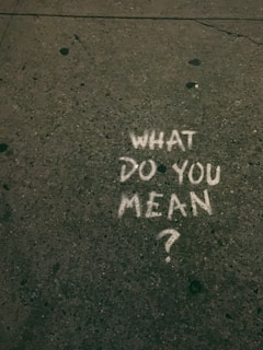 what do you mean? text on gray surface
