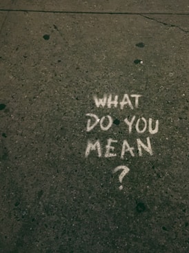what do you mean? text on gray surface