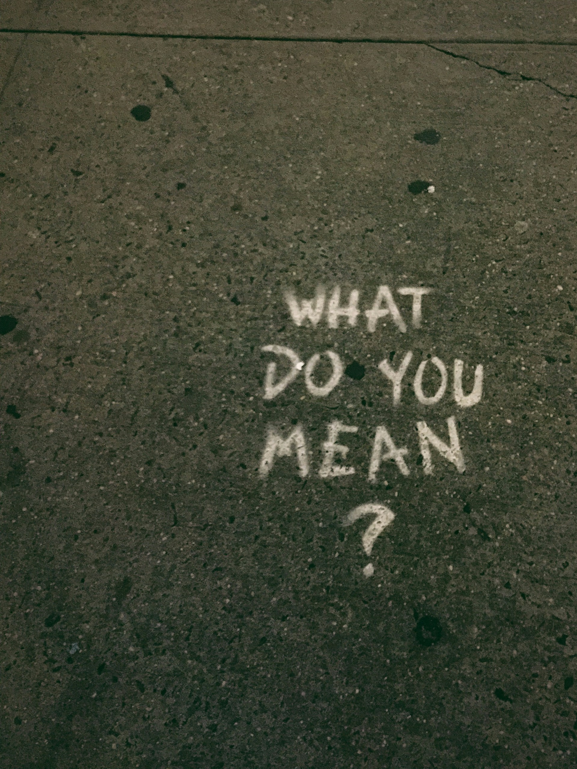 what do you mean? text on gray surface