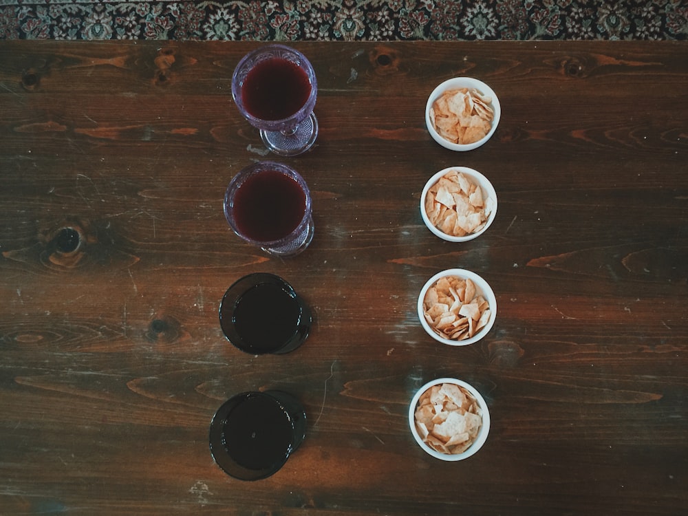 clear drinking glasses on brown wooden table