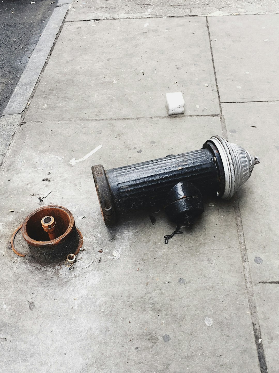 fire hydrant lying on it's side on concrete floor
