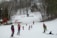 A family enjoying a joyful ski session at Saku Suusaklubi.