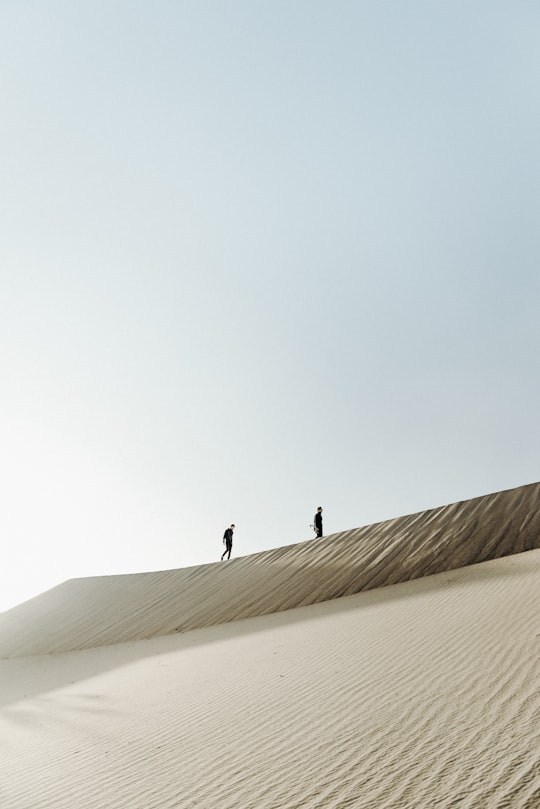 two men on the desert at daytime in Death Valley United States