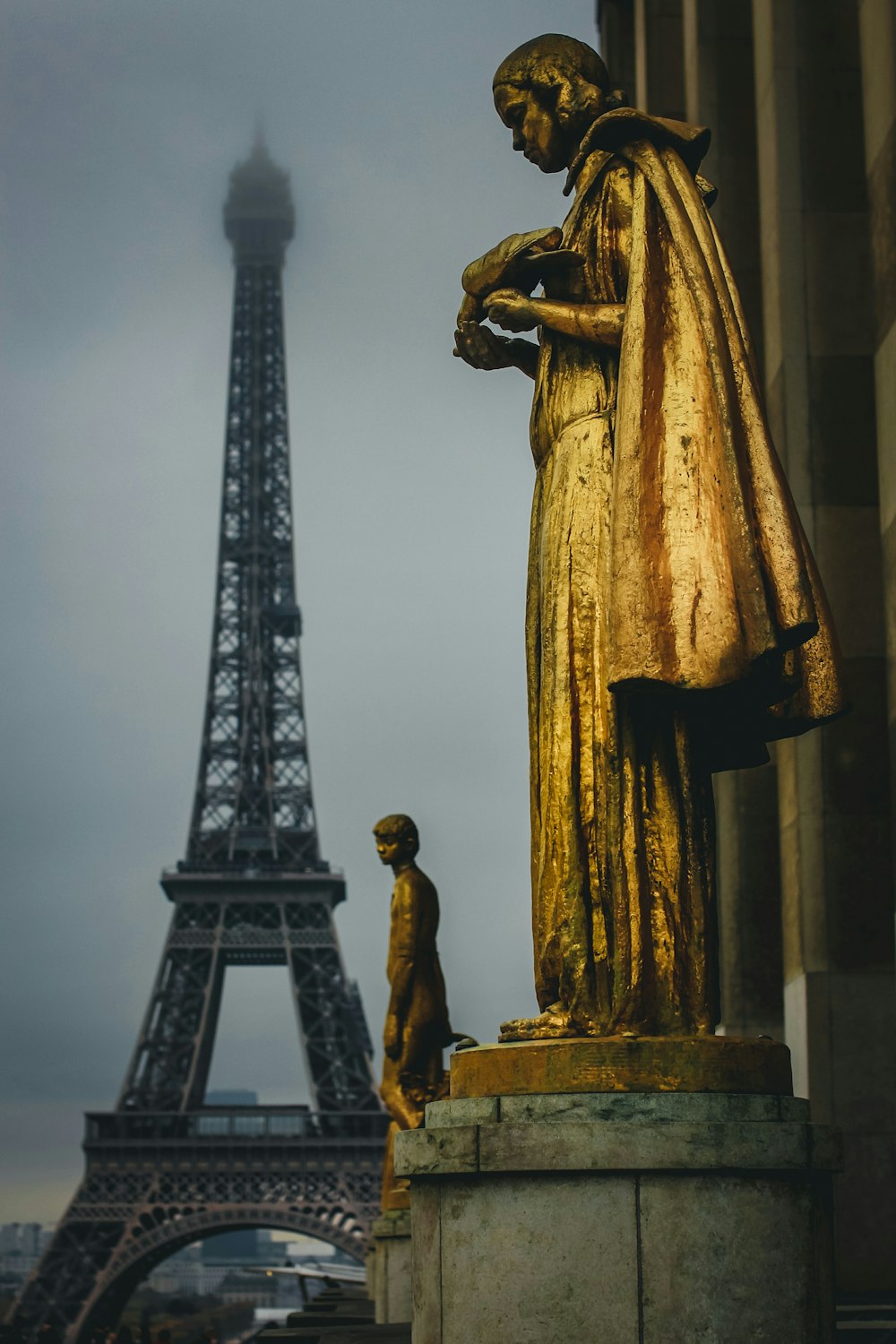 gold statue of a man and woman