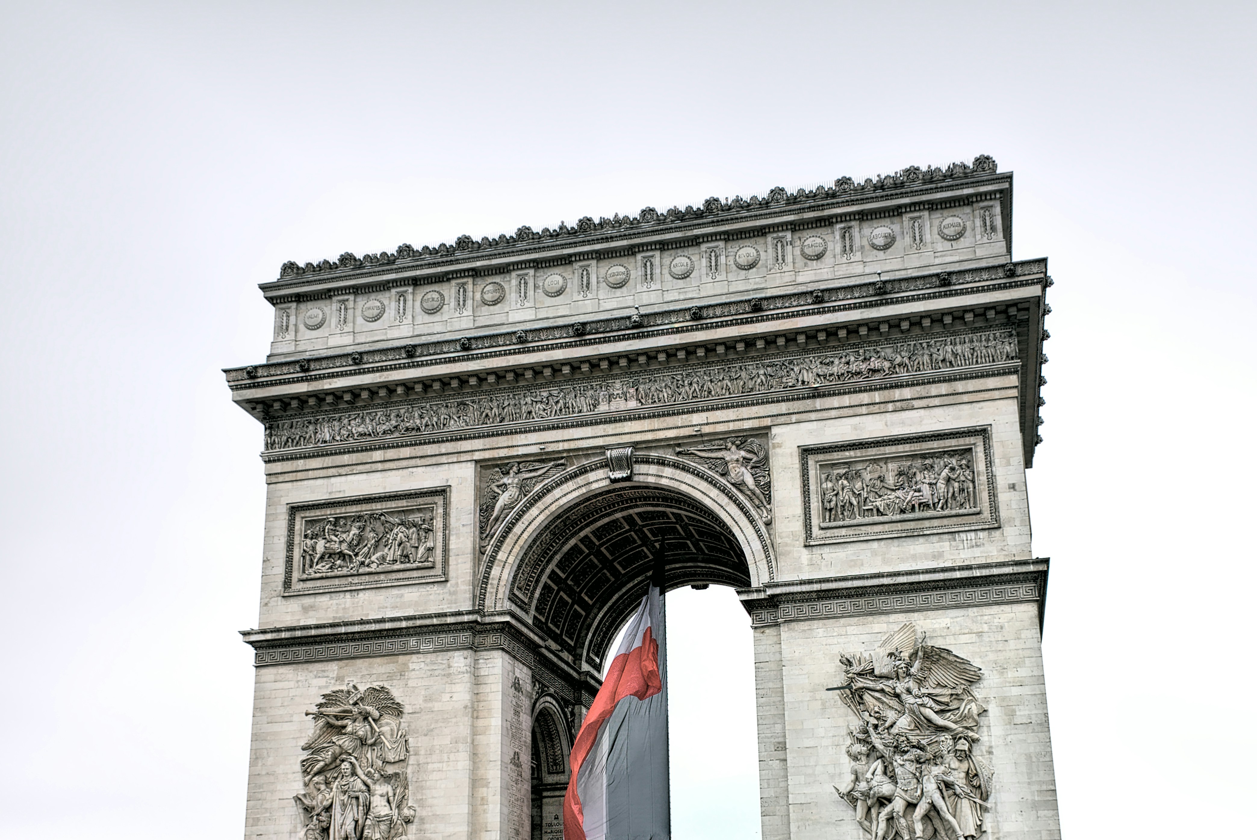 This is an old photograph that I took in 2016, at the time when Paris was flooded, the Siene was overflowing, and the sky was gray and boring. In this picture, however, I think the colours of the French flag contrasts nicely with the gray sky and somewhat plain Arc de Triomphe.