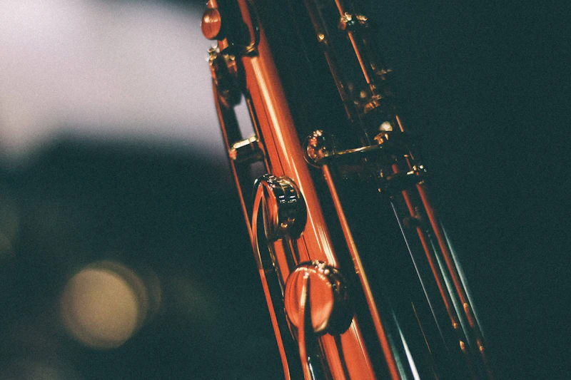 Macro close-up of a saxophone — brass keys and body in shallow depth of field
