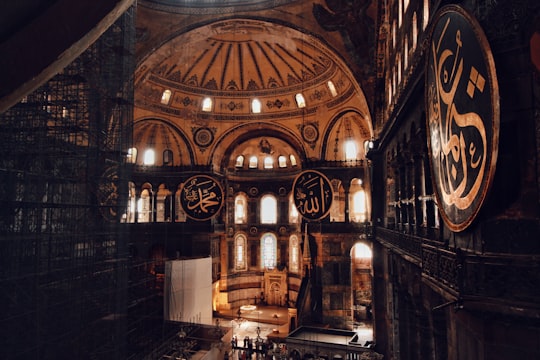 brown wooden chairs inside building in Hagia Sophia Turkey