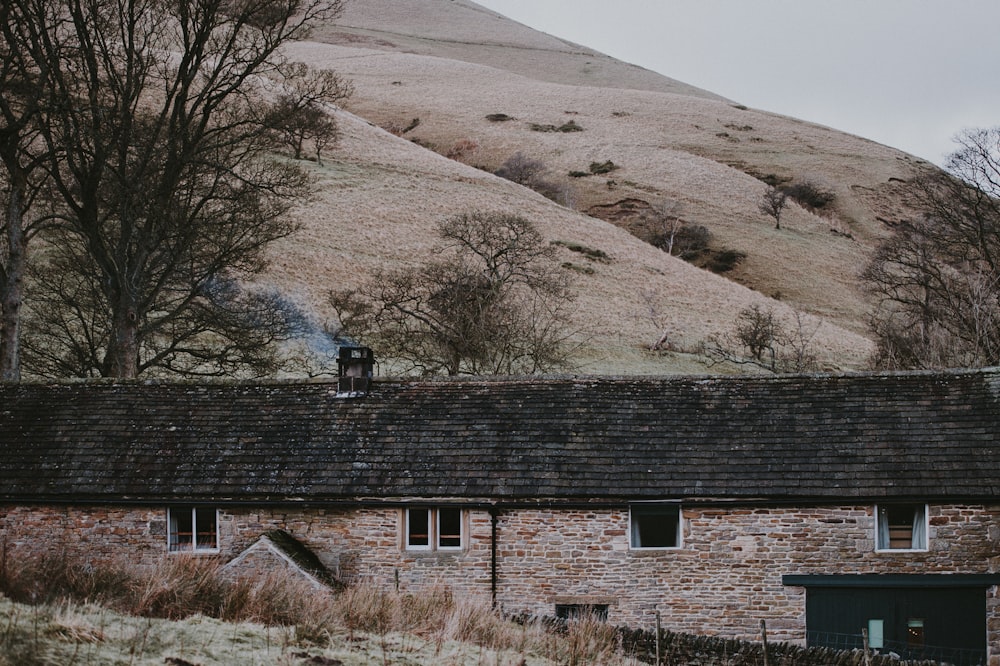 brown brick house near mountain