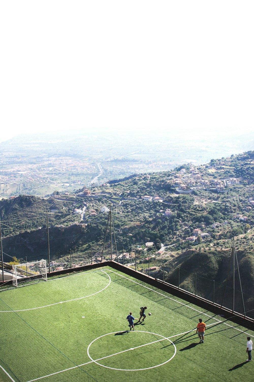 men playing soccer during daytime