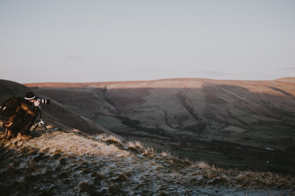 person talking photo on top of mountain