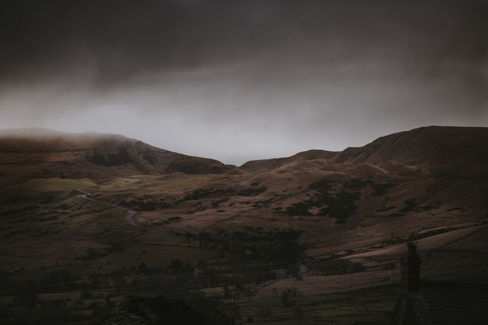 landscape photography of gray mountains under cloudy skies