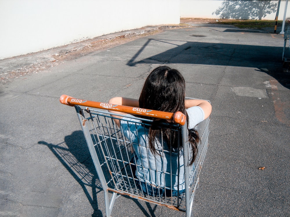 Girl in gray grocery cart photo – Free Pavement Image on Unsplash