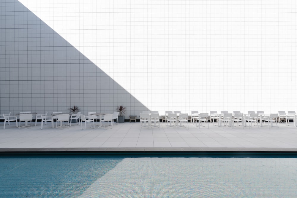 white patio table with chairs during daytime