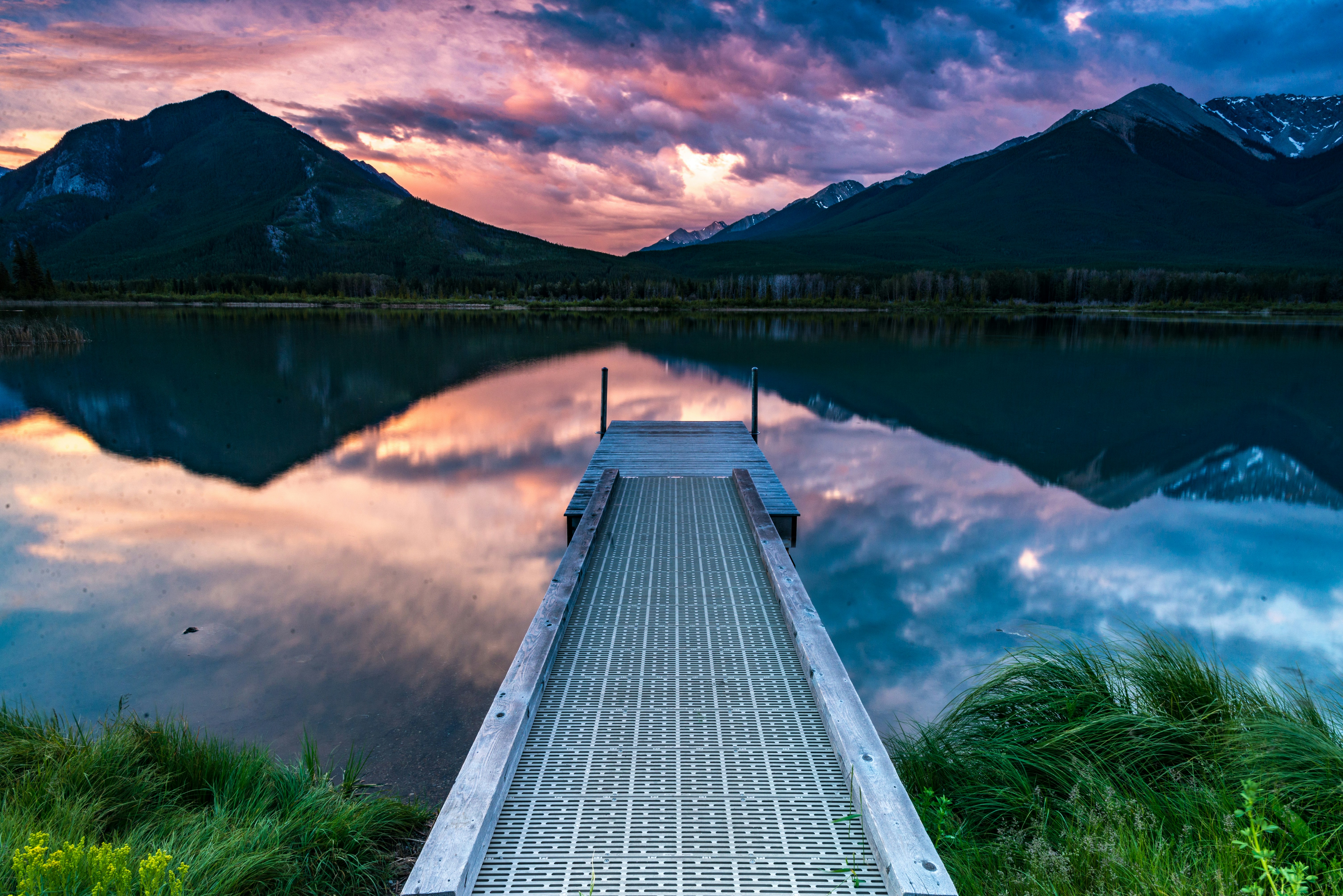 gray dock near body of water during daytime