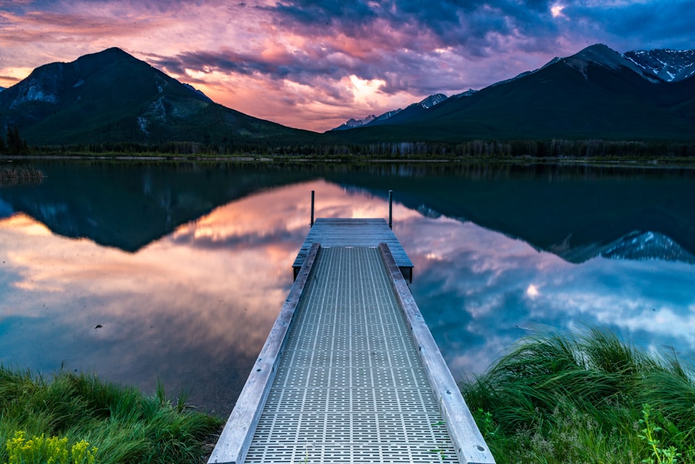 gray dock near body of water during daytime