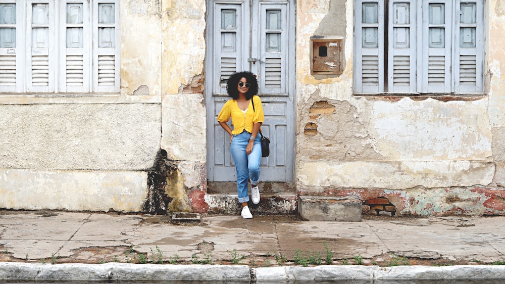 selective focus photography of woman leaning at closed doors